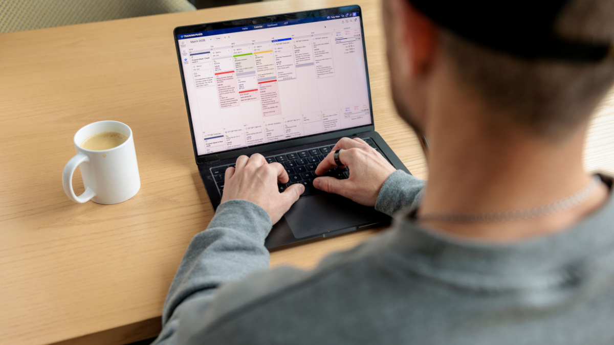Trainingpeaks Athlete Checking Calendar And Reviews Workout Metrics In The Trainingpeaks Web App.