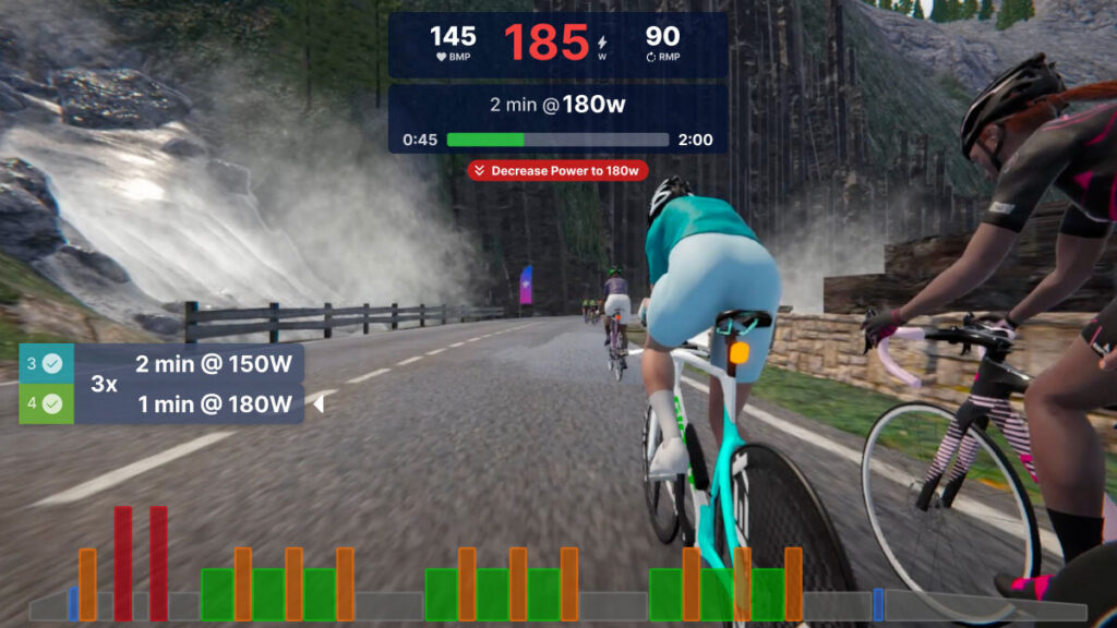 Screenshot of TrainingPeaks Virtual, showing an athlete riding intervals and being instructed to decrease Power.