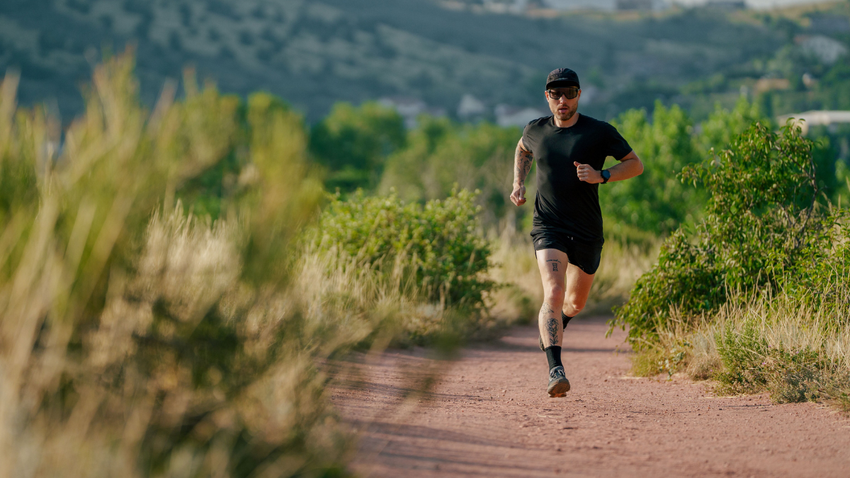 How Micro Burst Training Can Improve Vo2 Max Male Trail Runner Athlete Doing Micro Burst Training Outside On Dirt Running Trail To Improve Vo2 Max