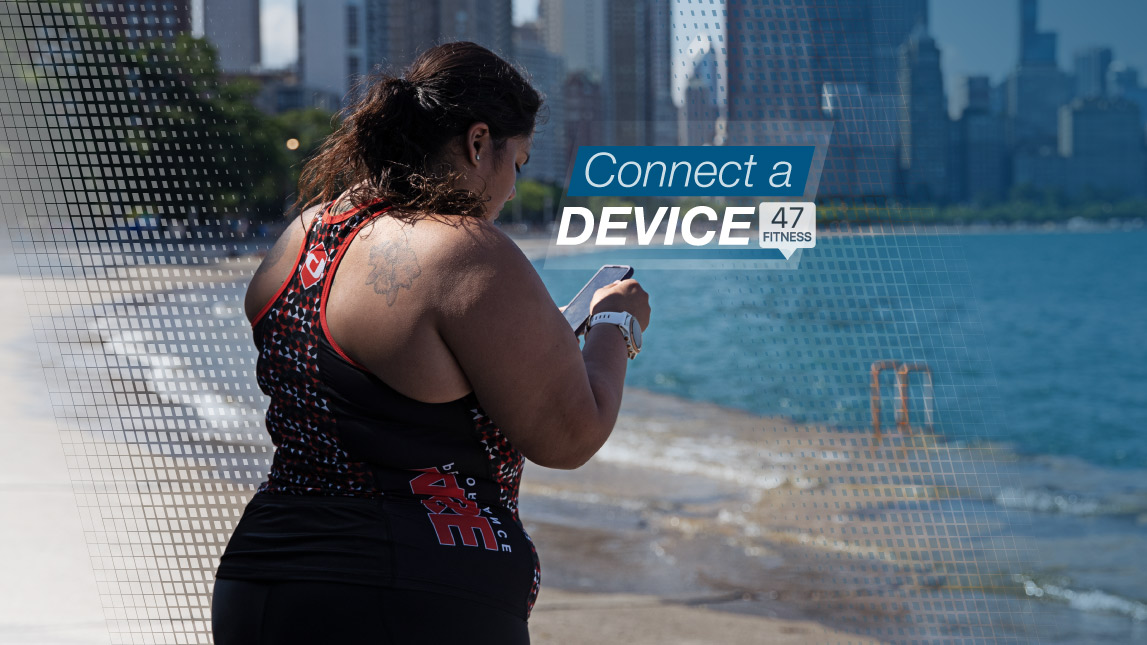 Woman Reading Phone After Run At The Beach