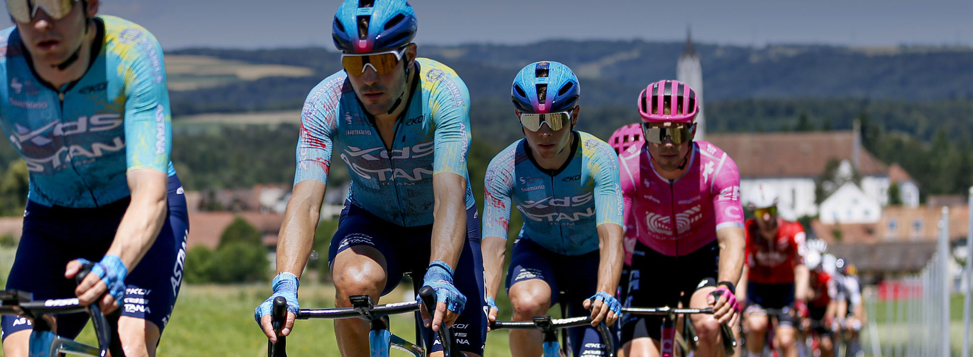 Male Professional Cyclist, Team Xds Astana, Riding Single File