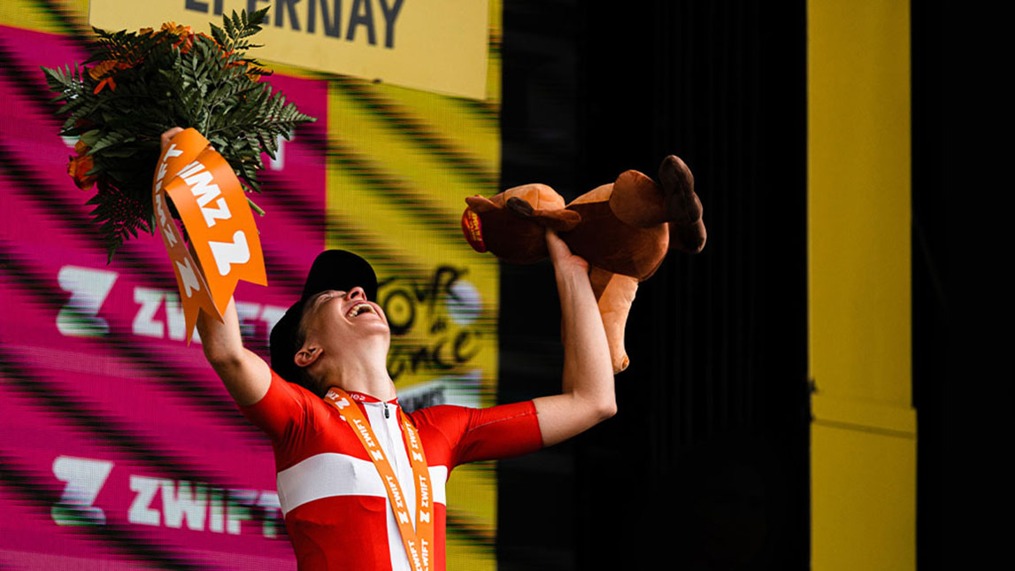 Podium Winner With Trophy And Flowers