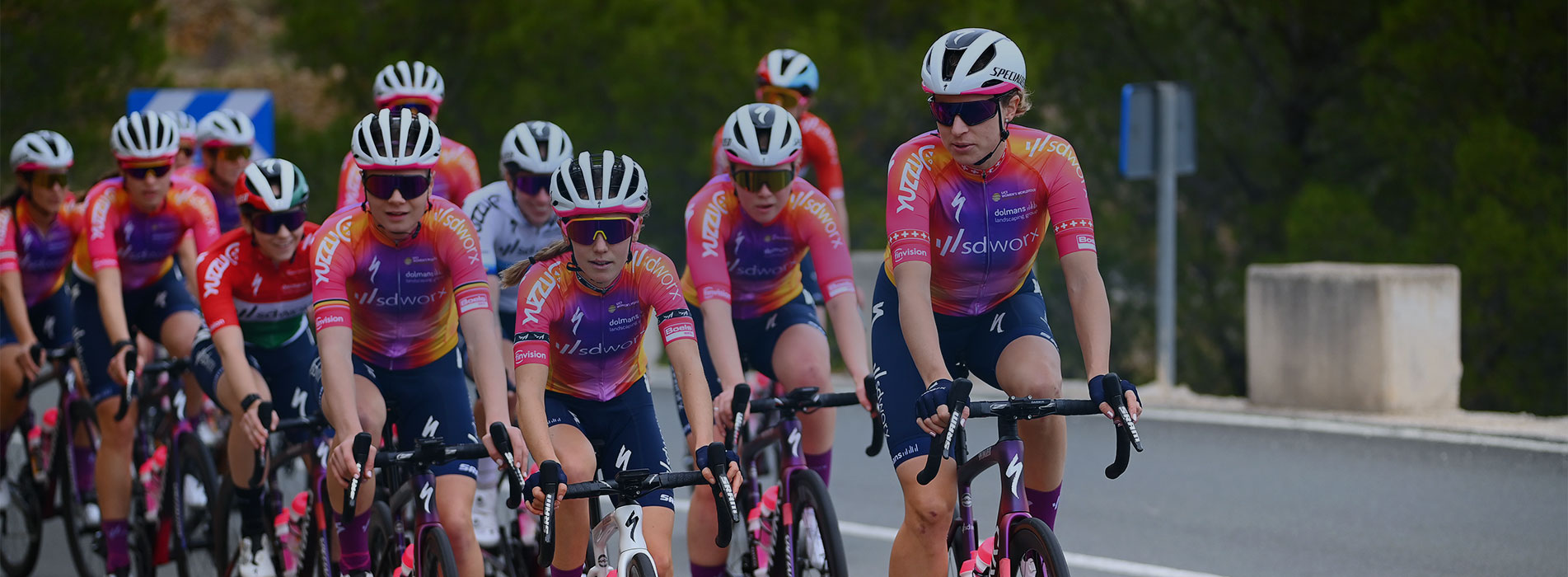 Women's Cycling Team Training In A Large Group