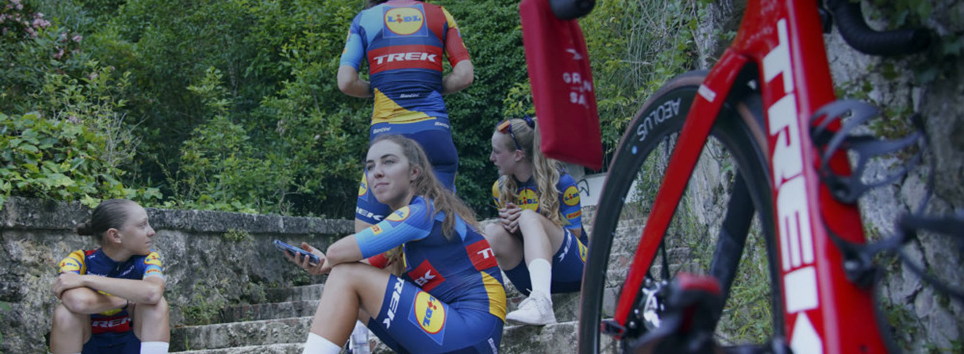 Women's Professional Cycling Team Posing On Stairs