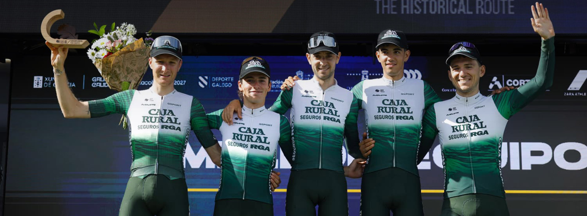 Trainingpeaks And Caja Rural Seguros Rga Professional Male Cycling Team, Caja Rural Seguros Rga, Posing Together On Podium