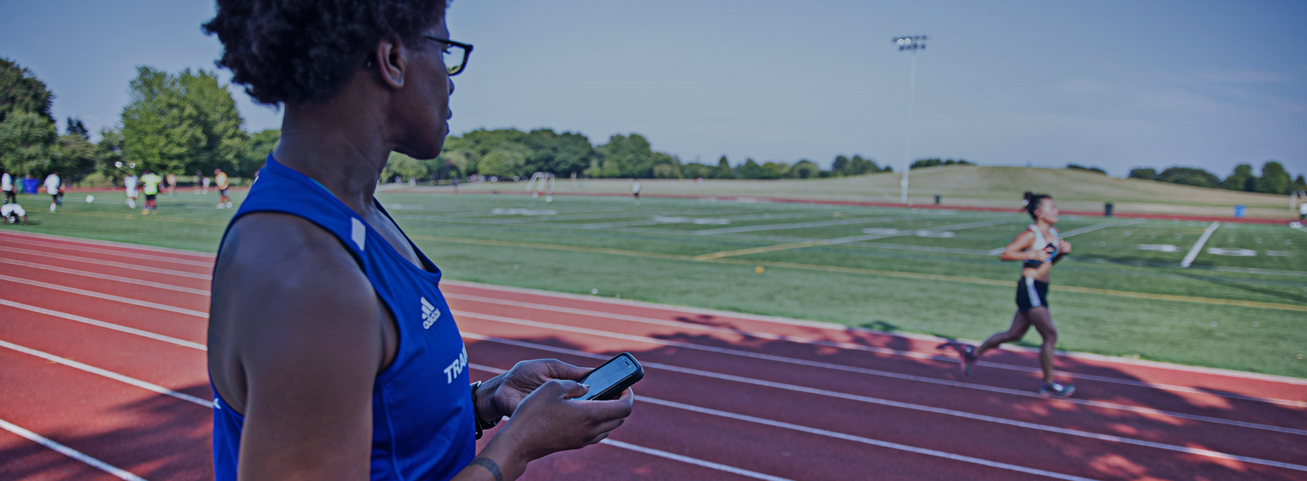 Female Coach At Running Track