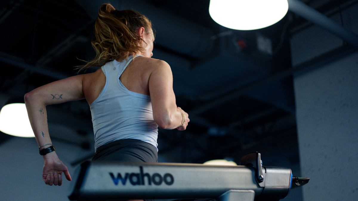Female Running On Treadmill Using Wearable Technology