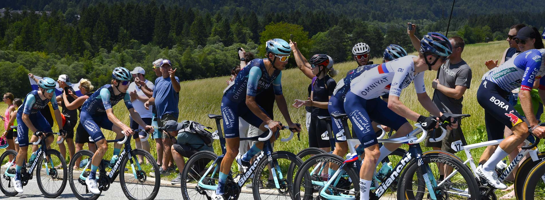 Male Professional Cyclists Racing Up Mountainside Bahrain Victorious Sprint Cycling Agency