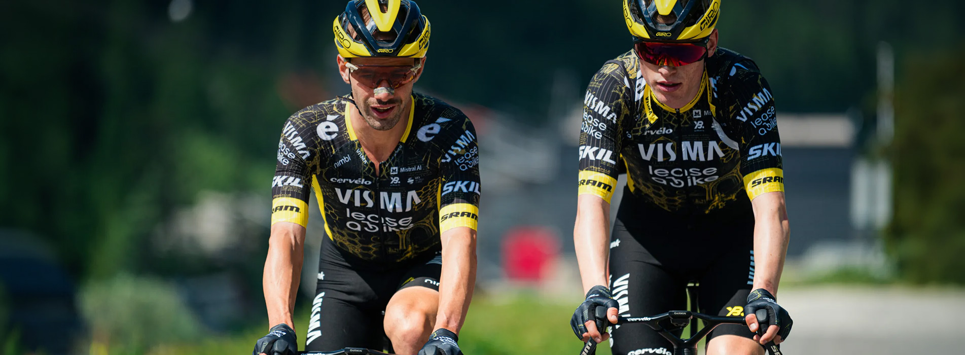 Trainingpeaks And Team Visma Lease A Bike Professional Male Cyclists Riding Together Team Visma Lease A Bike Hero
