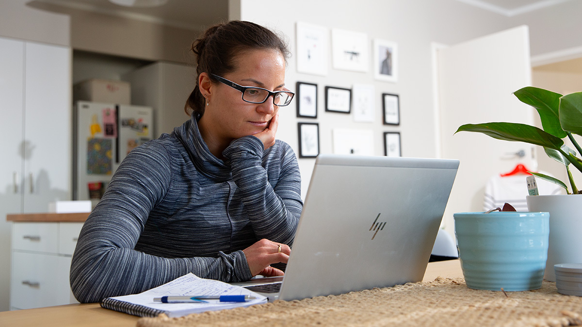 How To Become A Triathlon Coach Triathlon Coach Woman Sitting At A Desk On A Computer Making Training Plans For Athletes