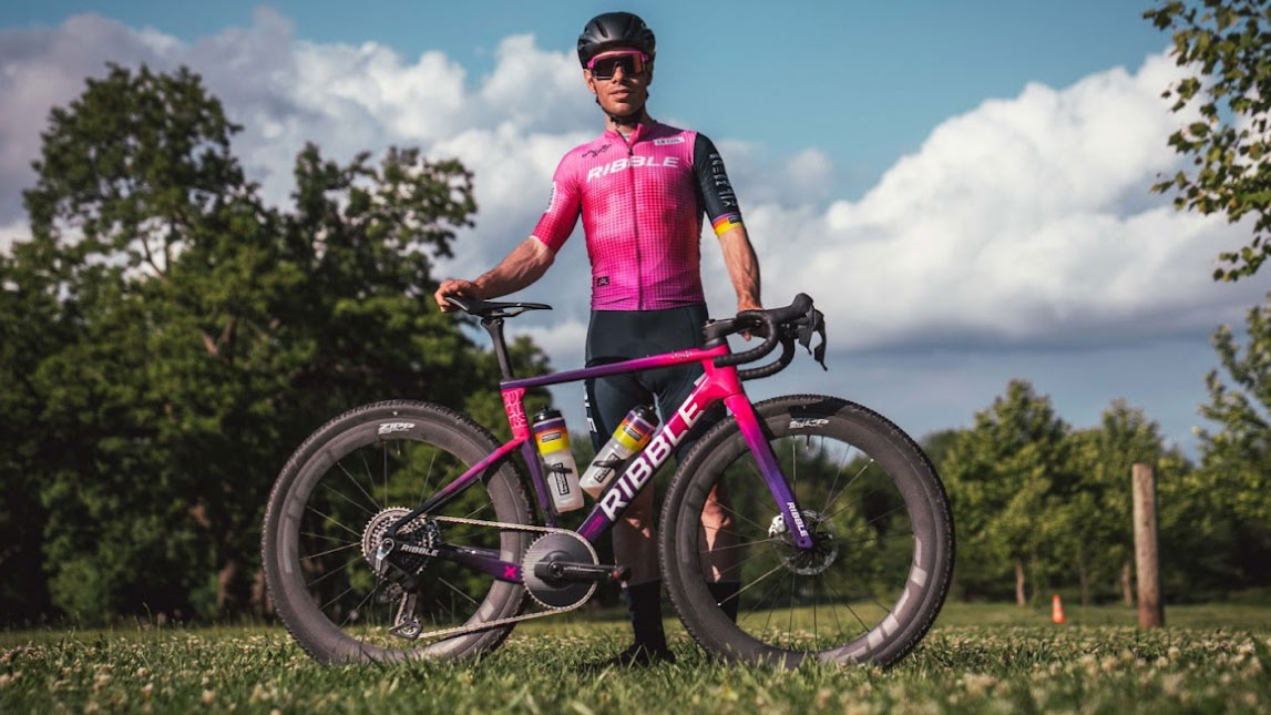 Ben T With Ribble Outliers Male Cyclist Ben T Posing For Photo On Grassy Background