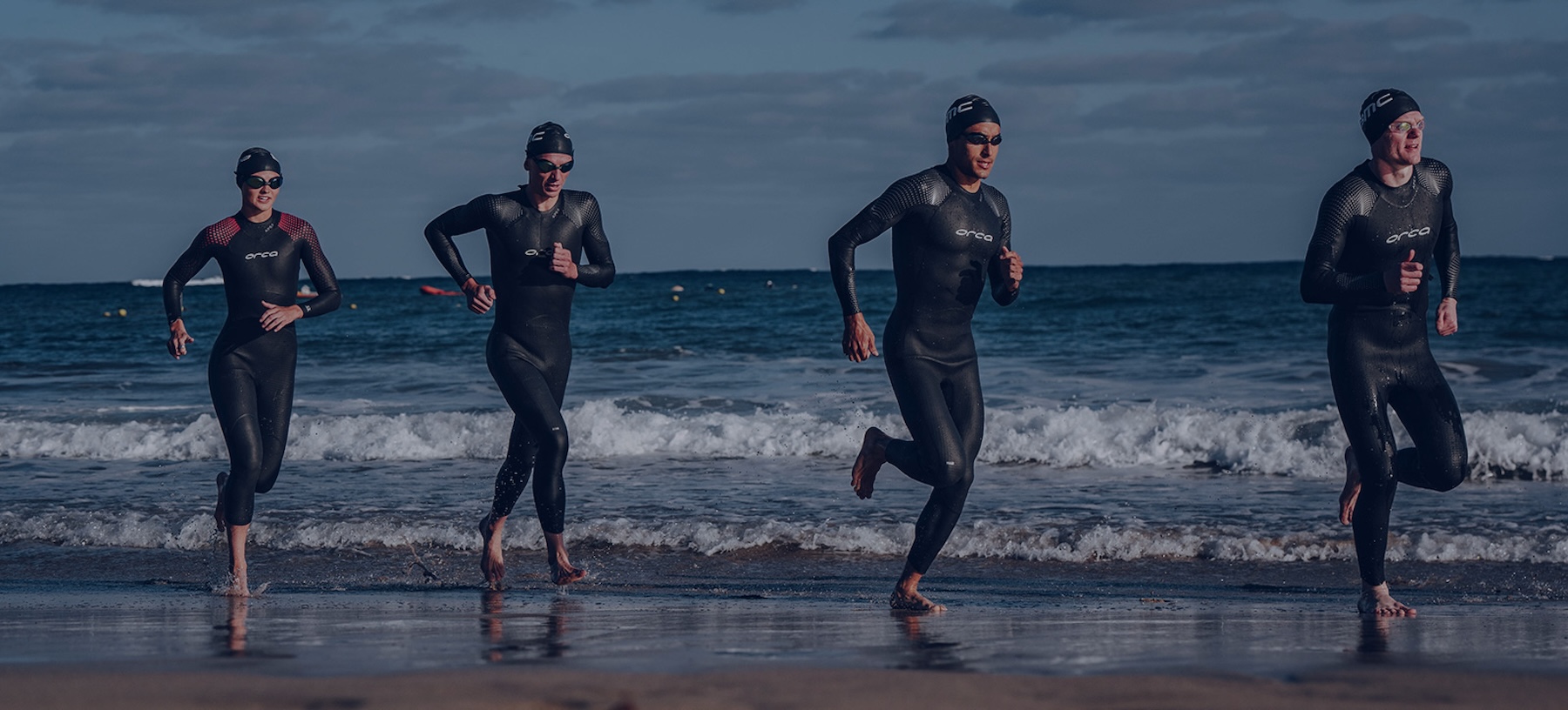 Triathletes Running On The Beach