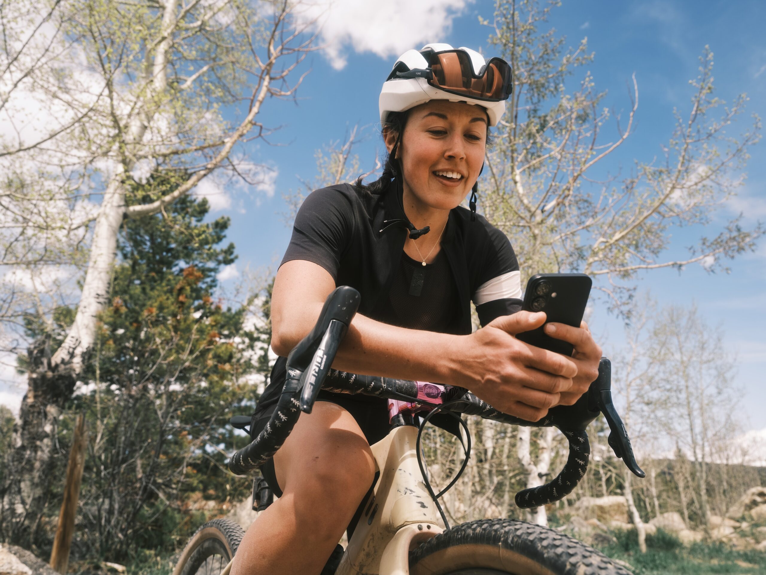 Messaging Beta Female Cyclist Messaging Coach, Sitting On Bike
