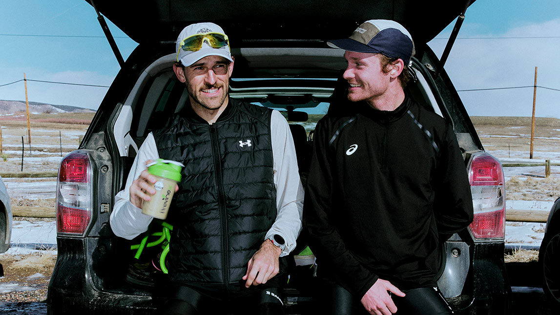 2 Male Hammer And Axe Athletes Sitting In The Back Of A Car Getting Ready To Go For A Run In The Boulder, Colorado Foothills
