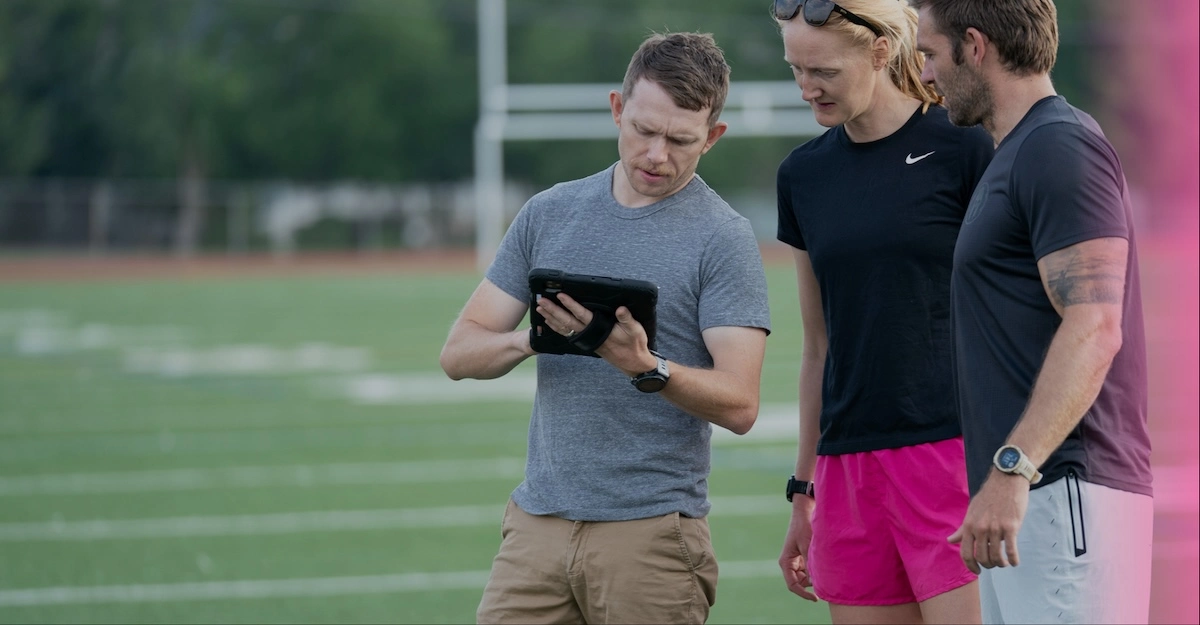 Coach Giving Feedback To Athletes