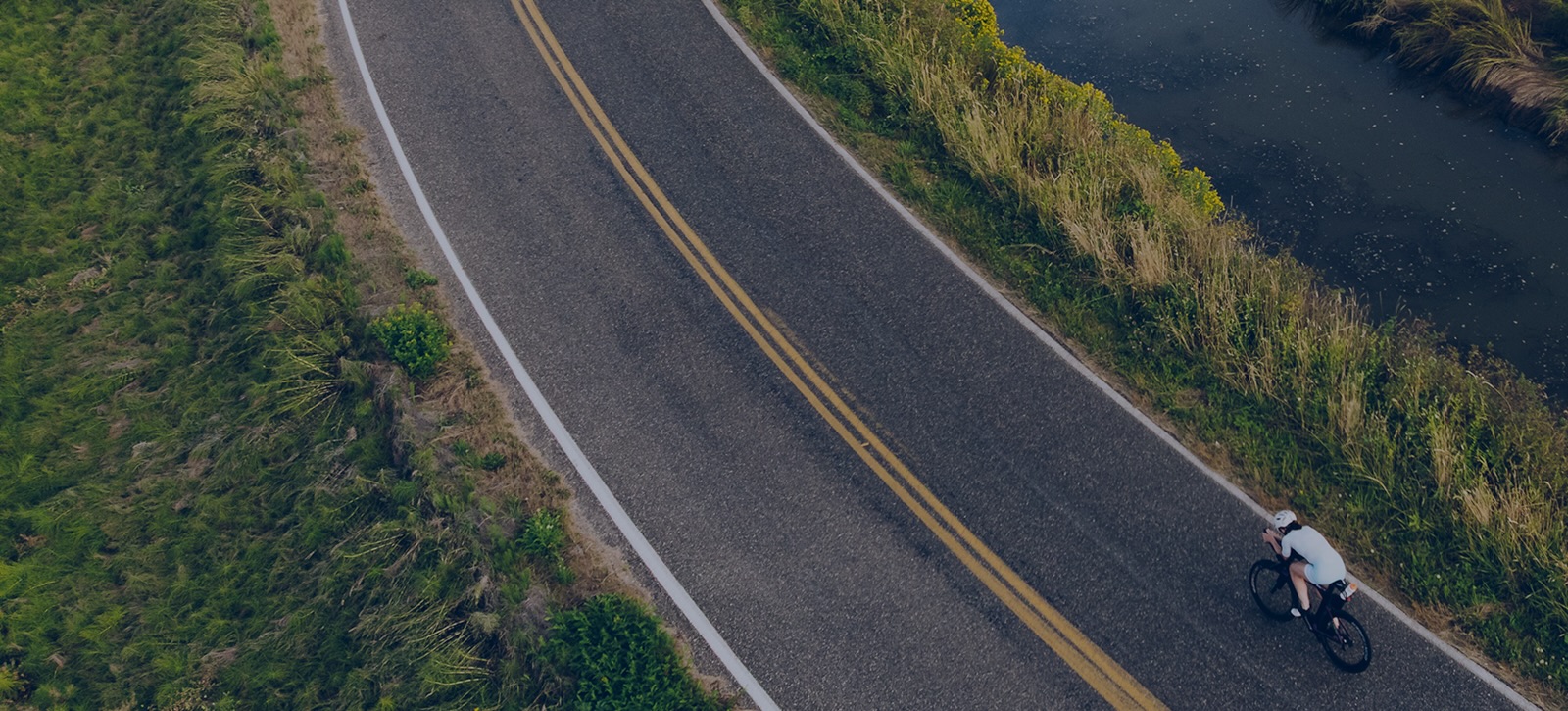 Triathlete Cycling On Road