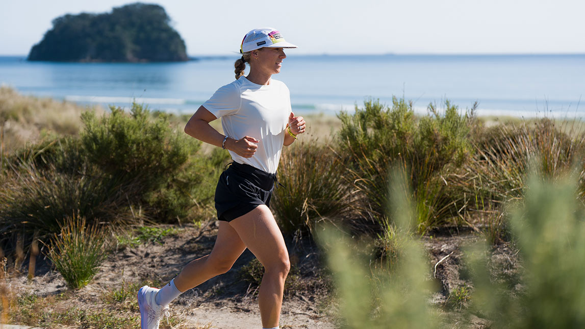 Hannah Berry And Trainingpeaks Female Running On Coastal Path By The Ocean Hannah Berry And Trainingpeaks