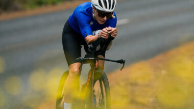 Female cyclist riding Time Trial bike down country road - Hannah berry and TrainingPeaks
