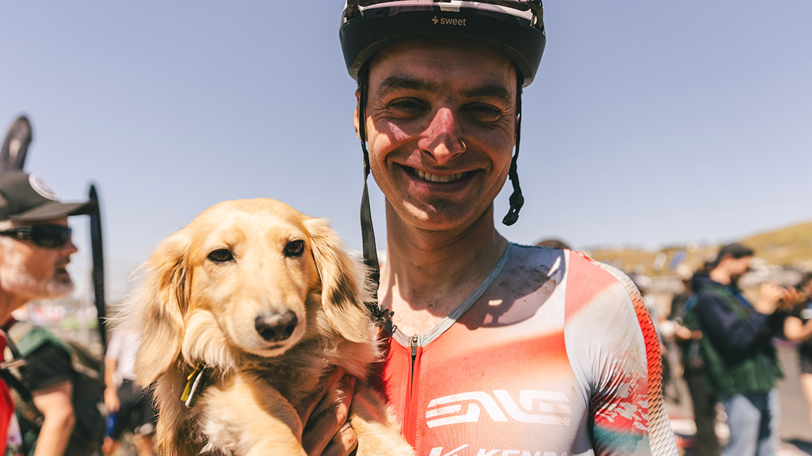 Alexey Vermeulen And Trainingpeaks Male Cyclist Holding His Cute Dog