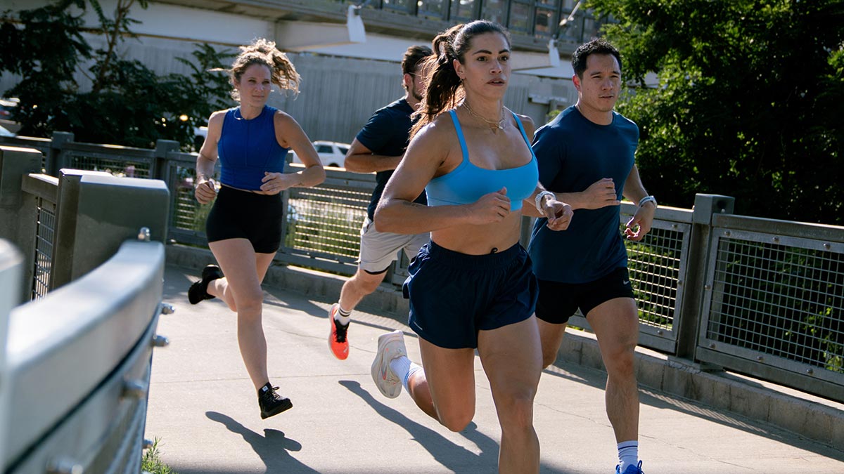 Group Of Runners Running On Bridge Group Of Runners Running On Bridge