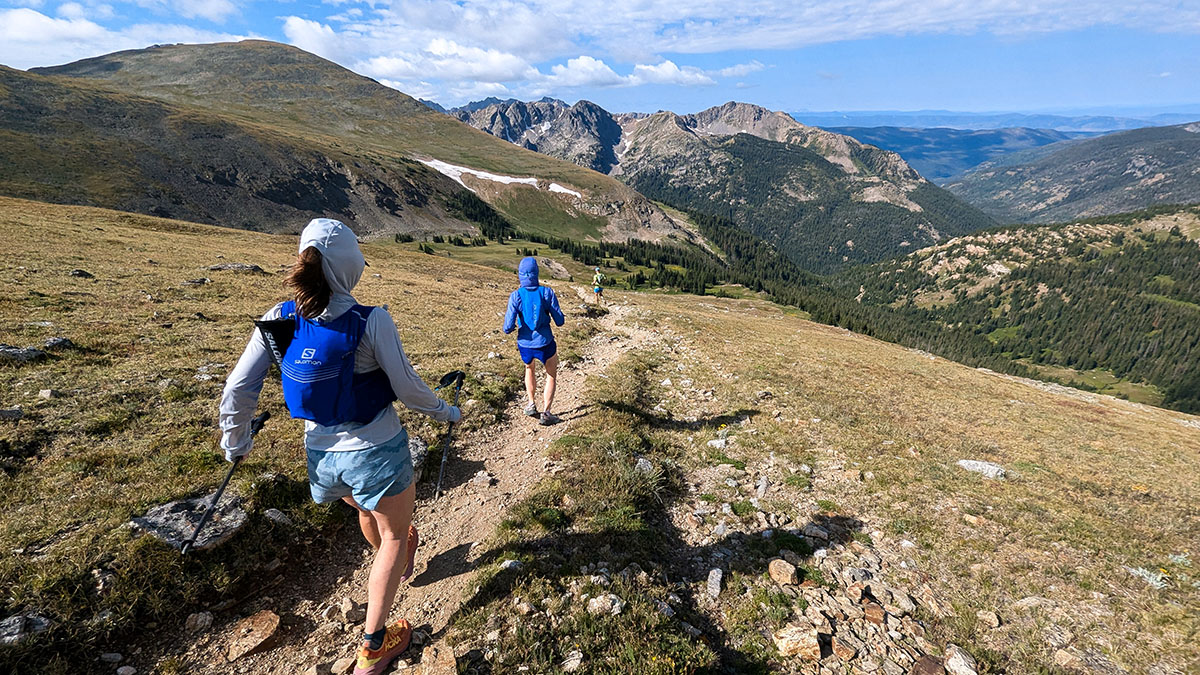 Three Ultrarunners On A Trail In The Colorado Alpine Above Treeline.