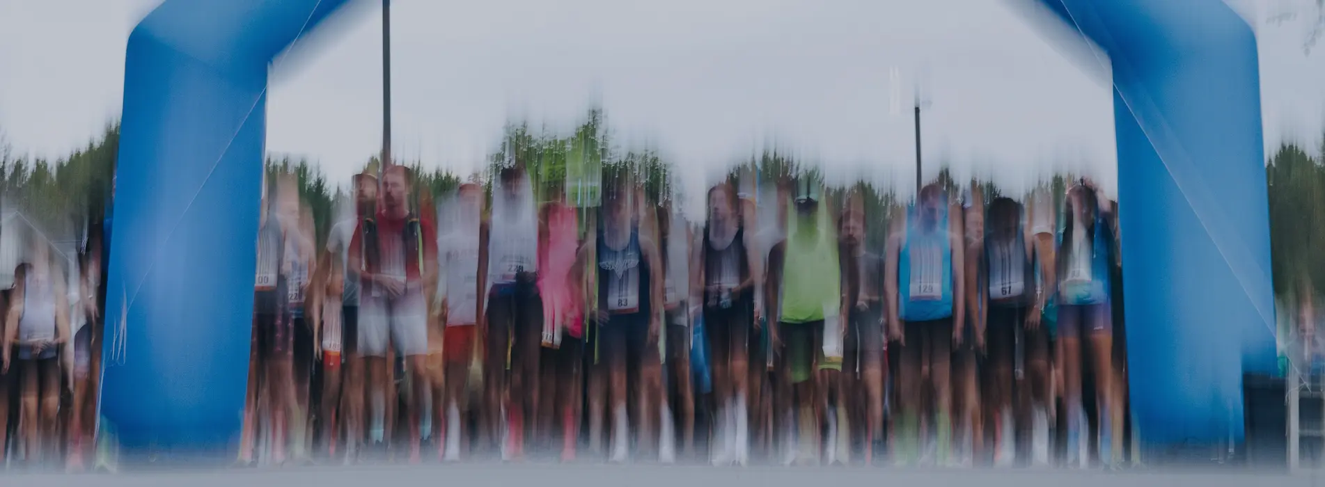 Blurry Image Of Runners Lined Up At Starting Point Blurry Image Of Runners Lined Up At Starting Point