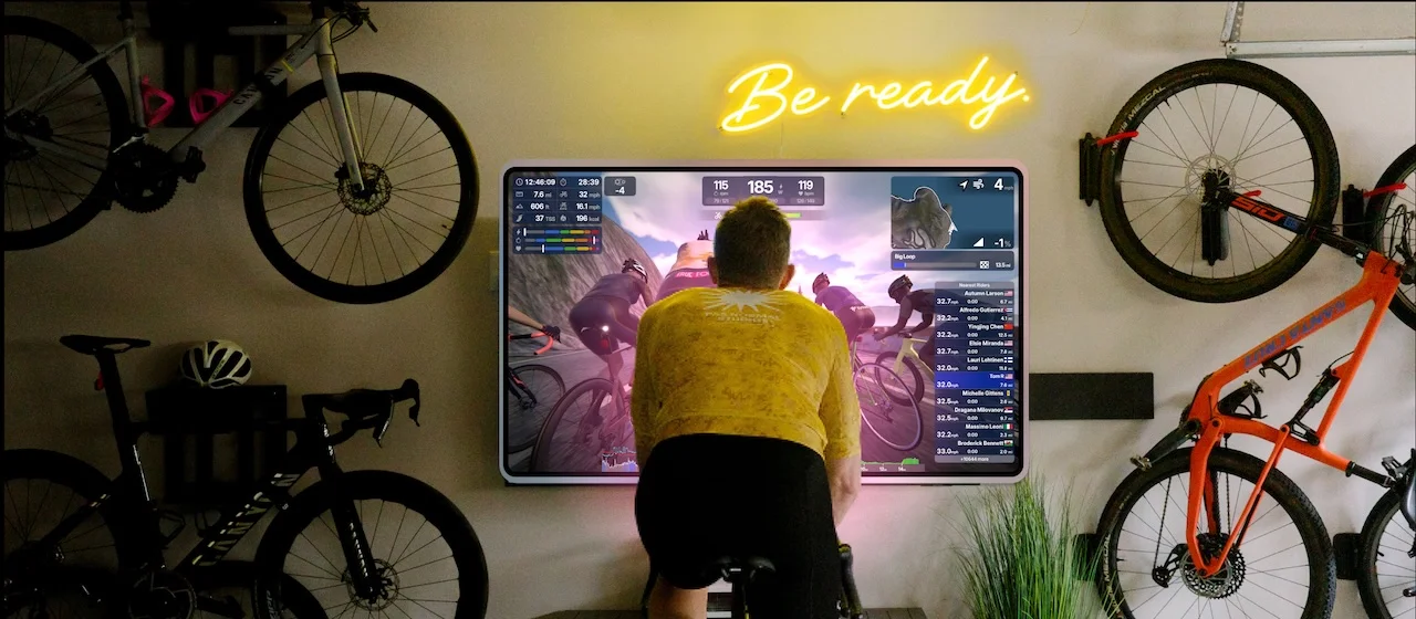 Athlete On Trainer Using TrainingPeaks Virtual On TV